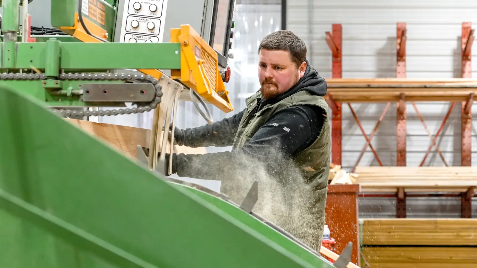 Western Building Supply team member cutting lumber for custom trusses in the Wheatland shop